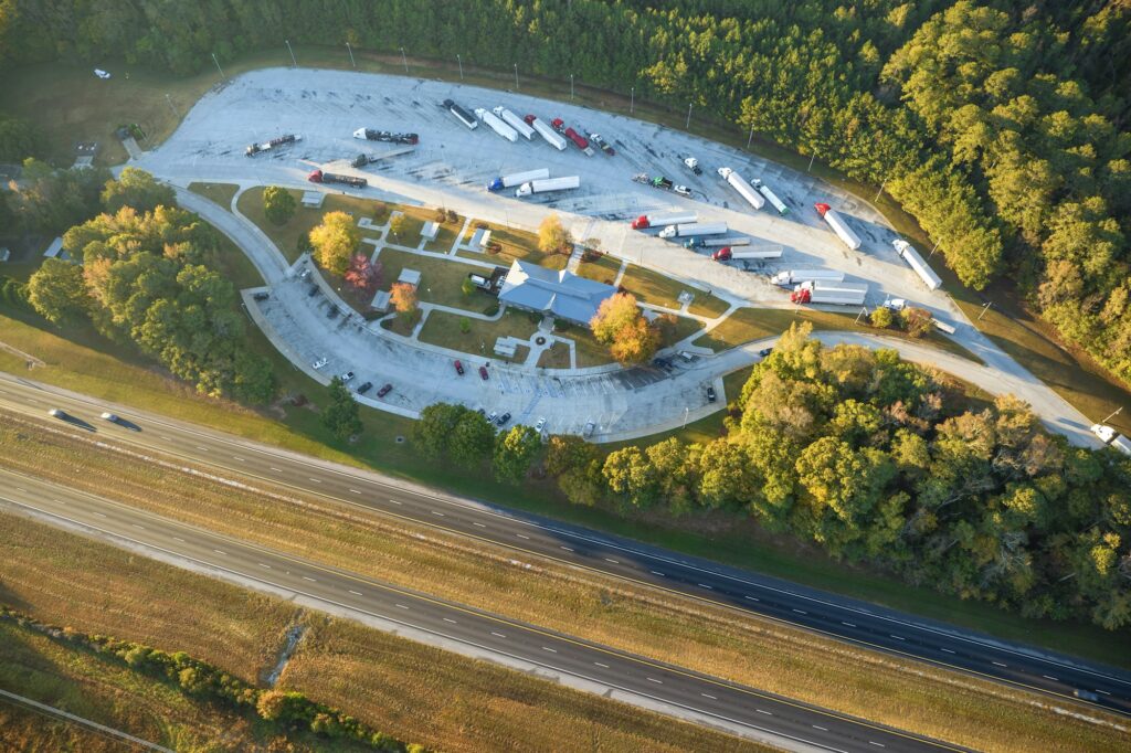 Large truck stop with resting area near busy american interstate freeway